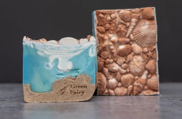 Soap slice that looks like the sand and the sea topped with sea shell details