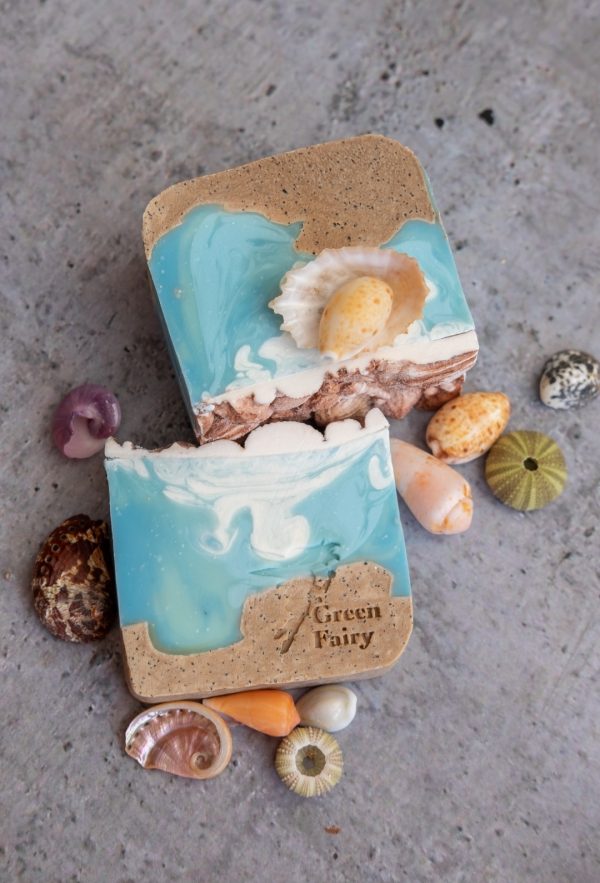 Soap slice that looks like sand and sea and topped with soap shell details